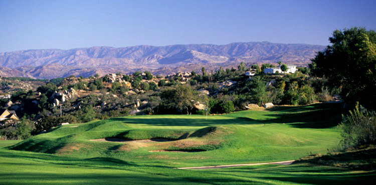 fairway with scenic mountains in the background